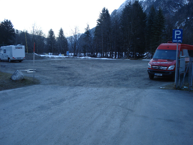  Parking seen from the entrance..  The Lech flows on the trees.