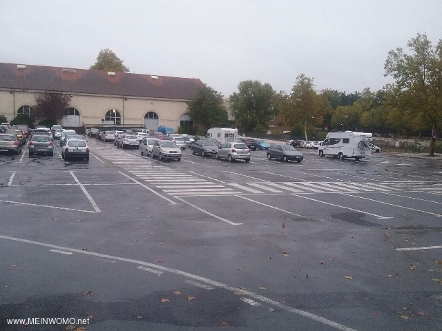  A normal large parking lot that does not necessarily invite you to linger.
