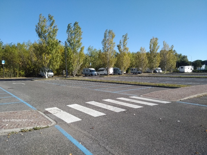 Parking spaces on the left side of the large car park. 