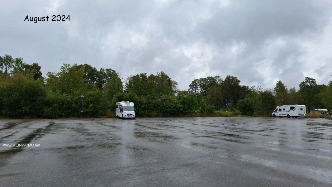 The parking space at the edge of a large parking lot.