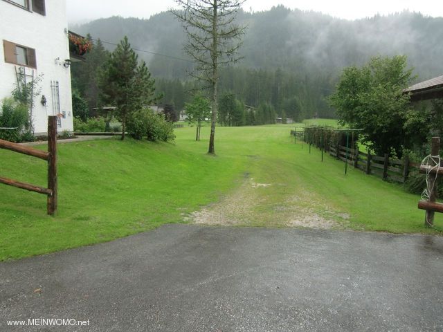  The entrance to the meadow parking lot behind the main building photographed from the access road.
