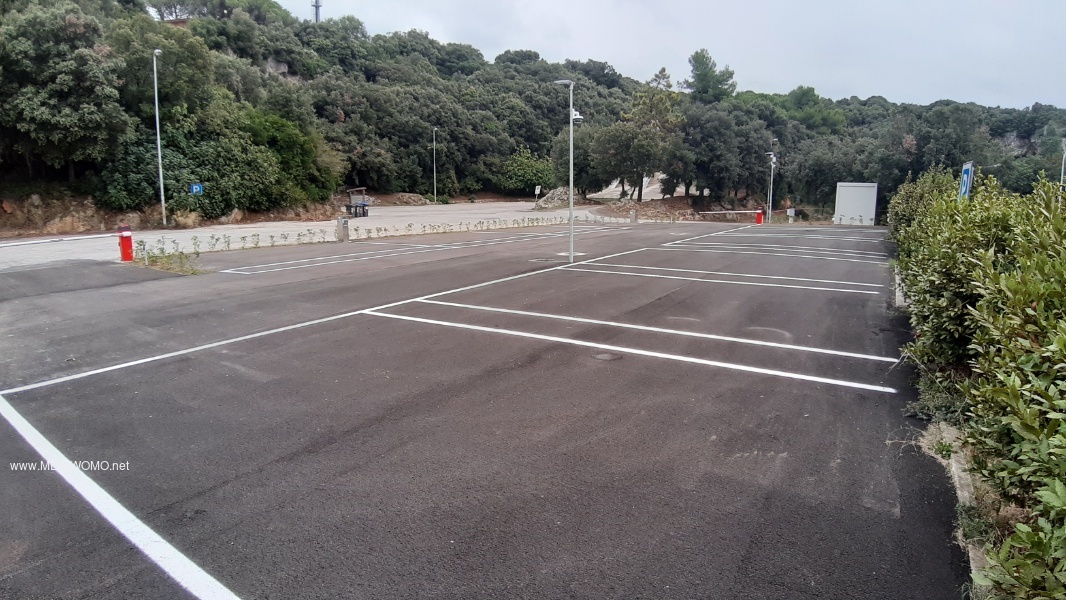 Shows the new parking space with barriers. 
