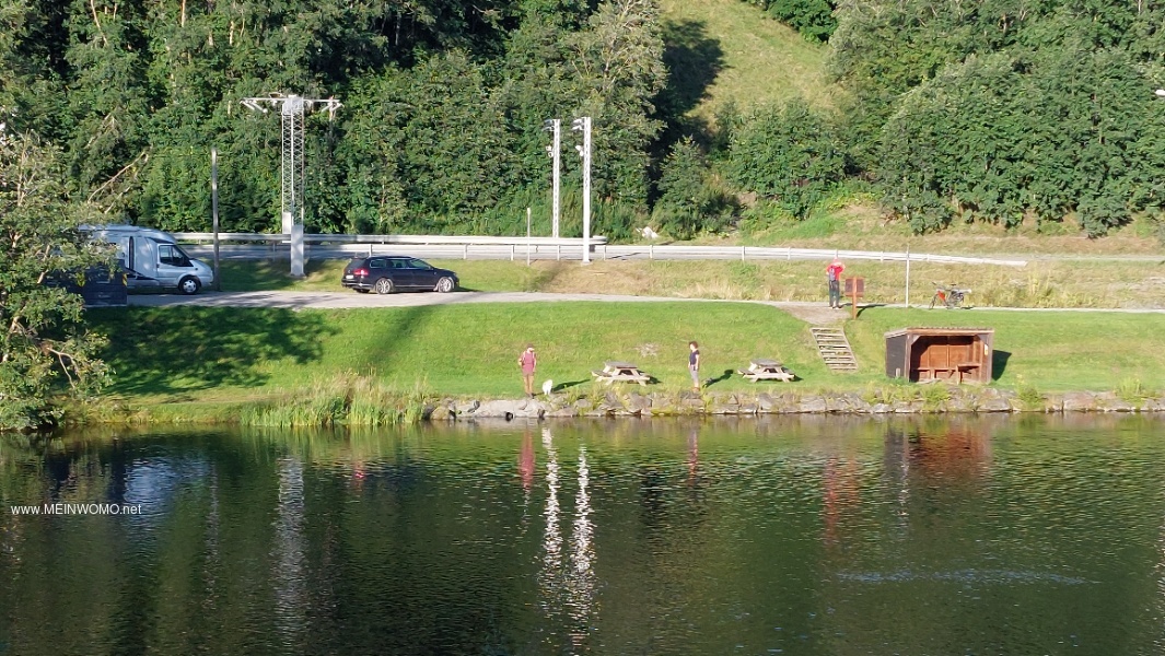    Parking space seen from the opposite bank of the river     