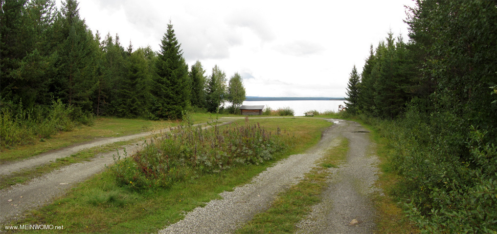  Alans Nature camping, View from the entrance to the square, in center on the lakefront, grill hous ...