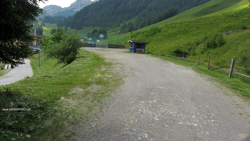  Zauchensee;.  the empty square from the driveway, behind it the basketball court.