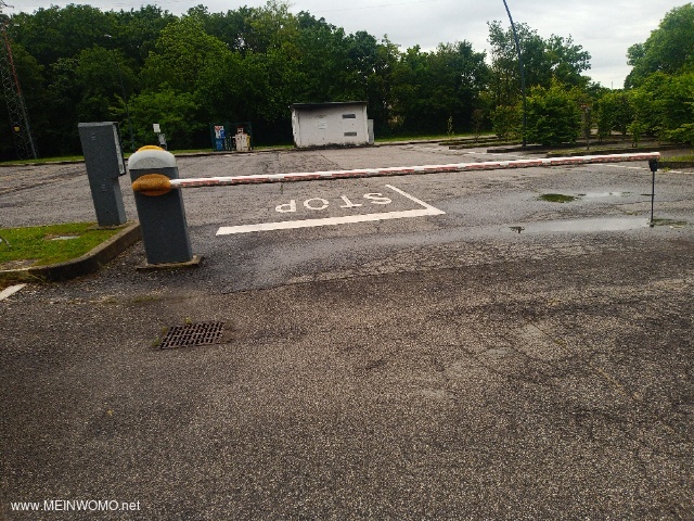 Parking space with entrance barrier